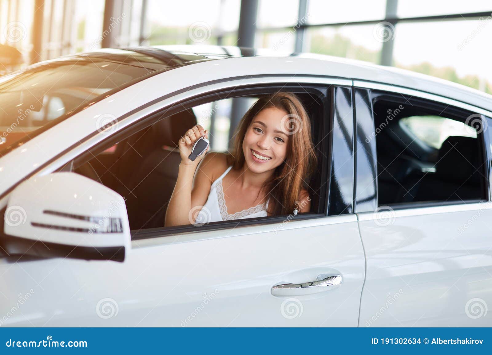 Happy driver holding car keys